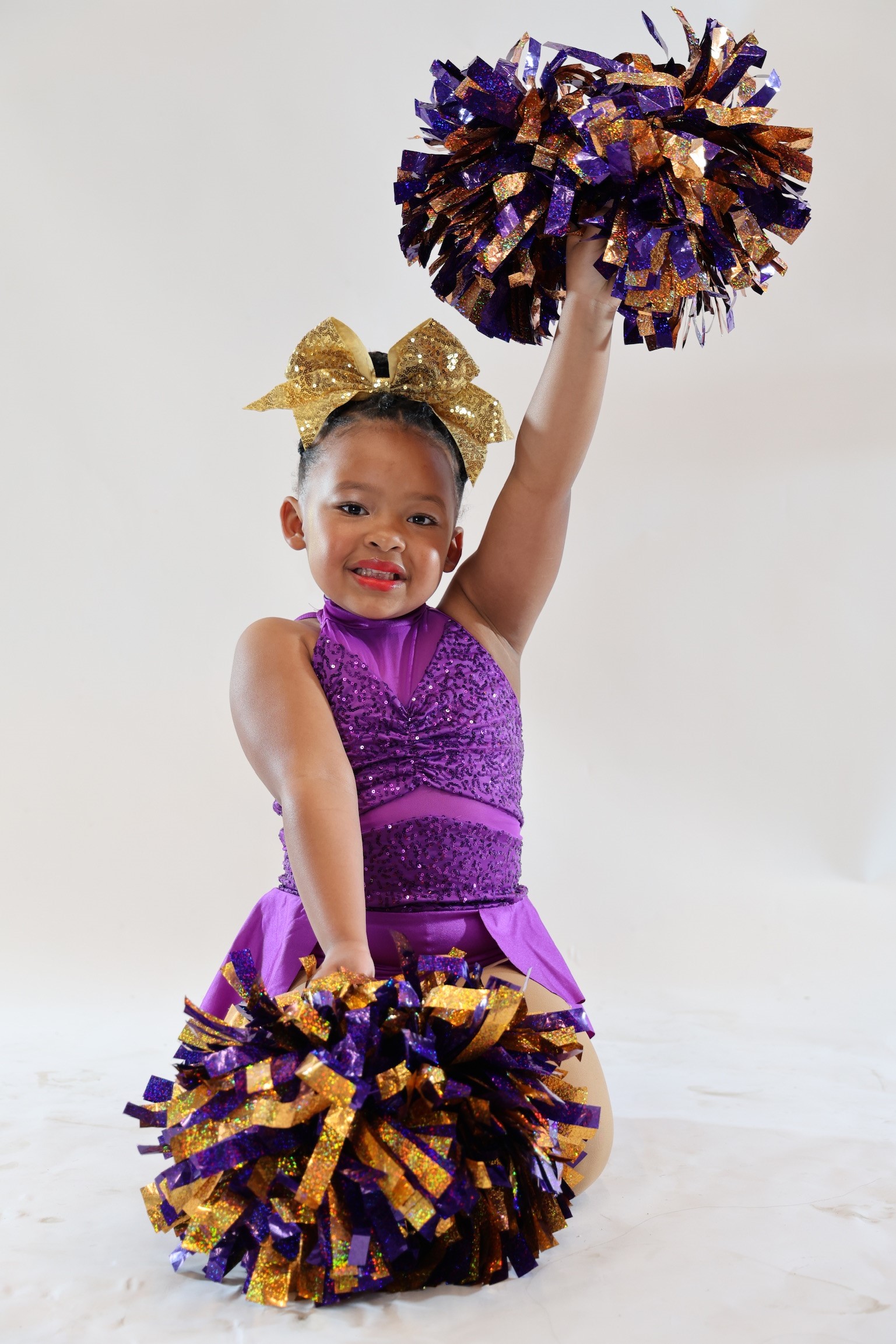 Royal Jewels young dancer with pom poms